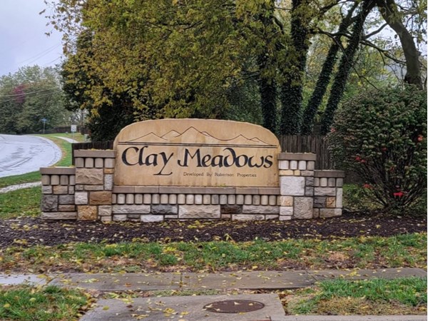 Clay Meadows stone entrance monument sign at the neighborhood entrance